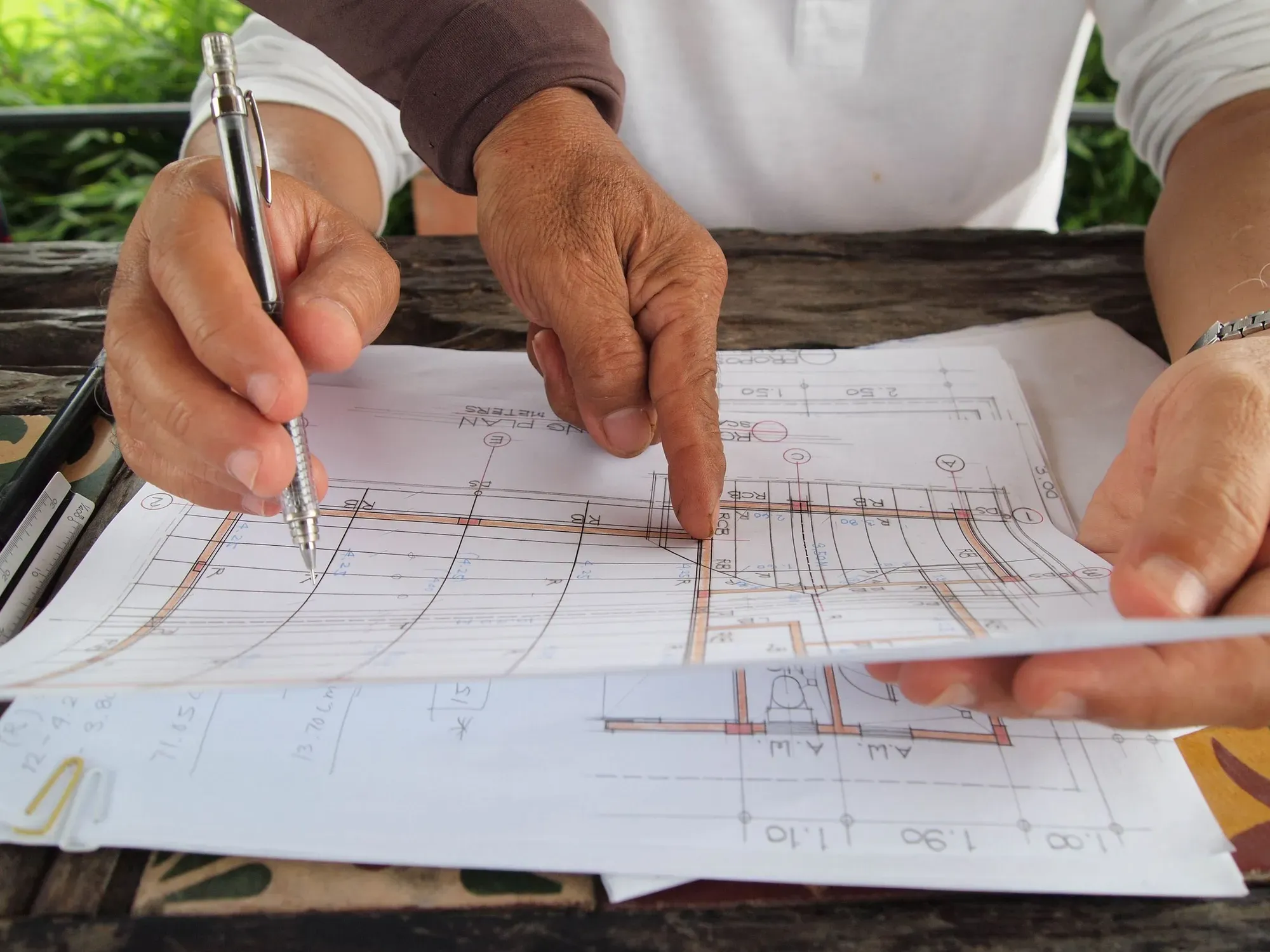 Planners reviewing detailed building plans